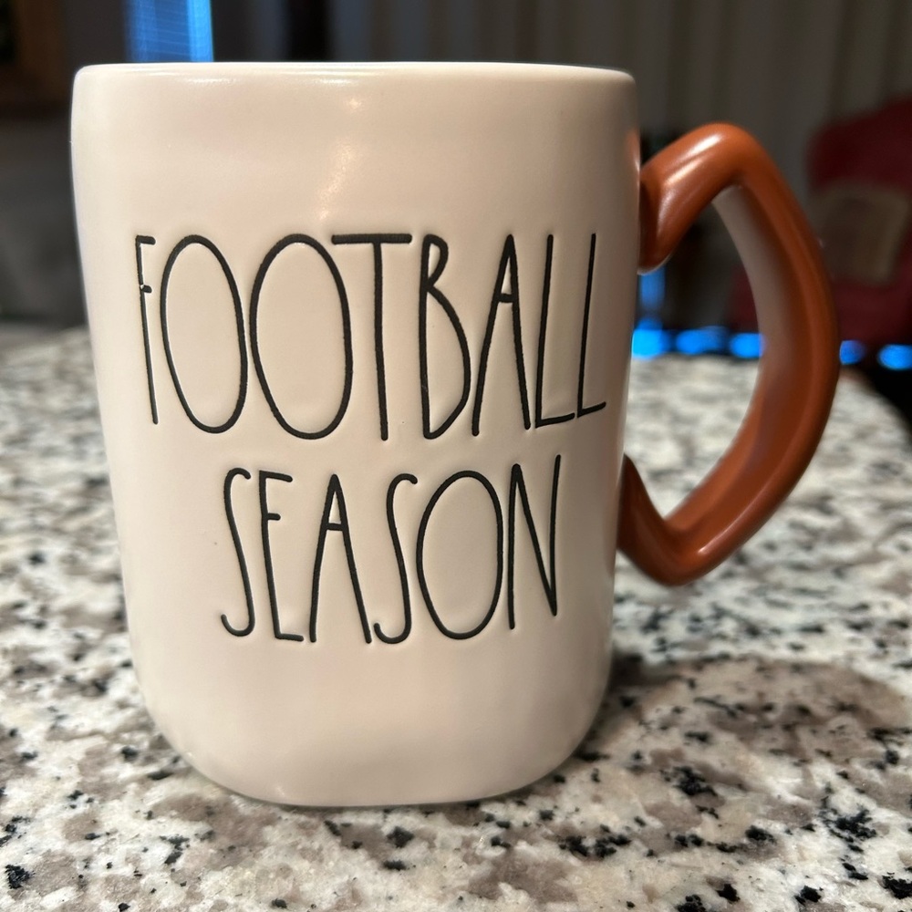 Rae Dunn Football Season Mug with a football shaped handle.
